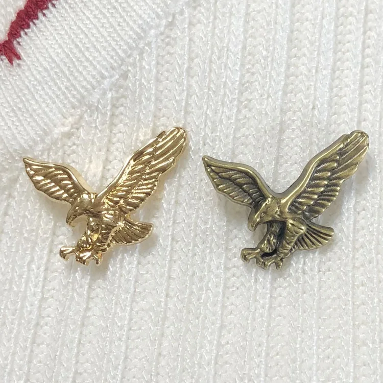 
OEM trendy metal embossed bird shape lapel pin 3D mini gold eagle badge emblem 