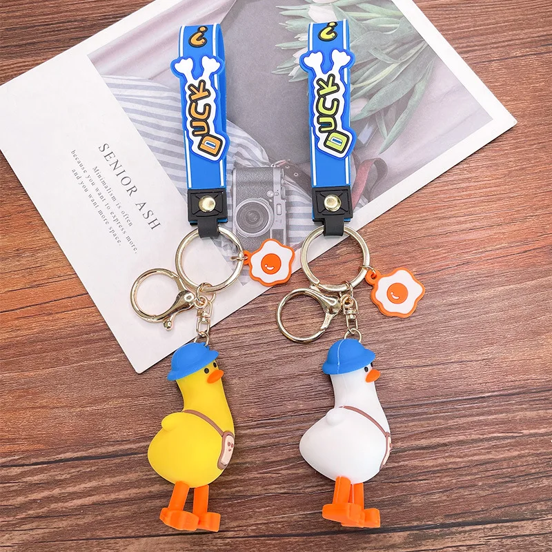 Funny tilt head duck cute anime pvc 3d keychain custom logo pvc rubber keychain Key Handbag Accessories