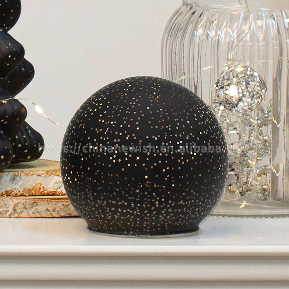 Lighted Christmas ball mirror surface reflects tiny pinpoints light like a starry sky decoration