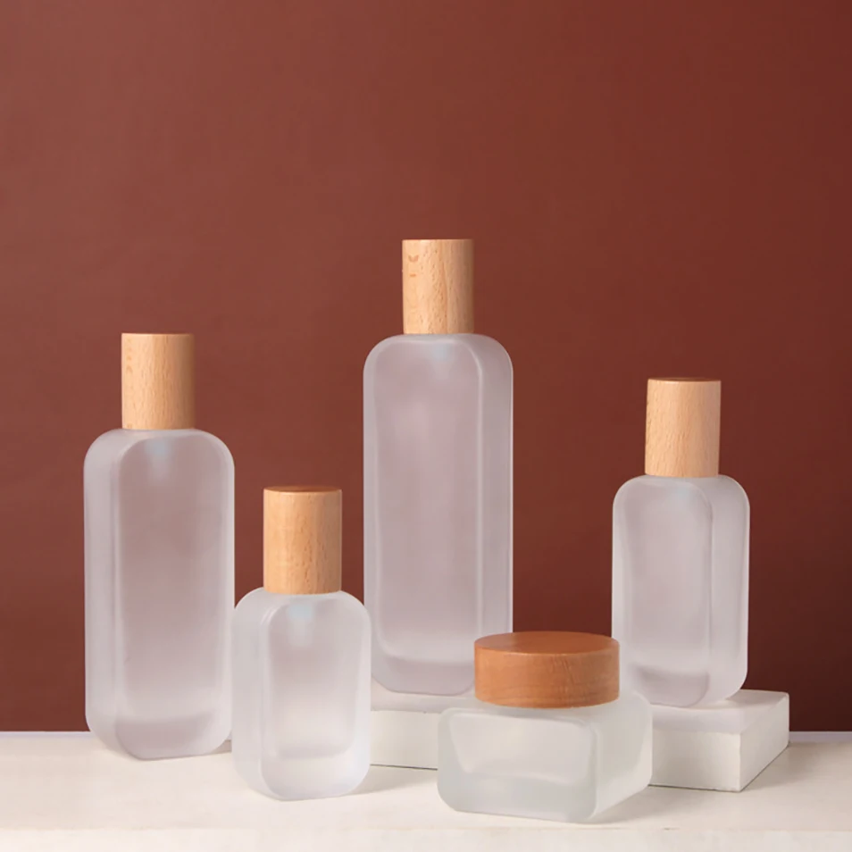 New Style Flat Rectangle Shape Frosted Cosmetic Pump Bottle 30ml 50ml 100ml 120ml Glass Shampoo Bottle Wooden Cap Cream Jar 50g
