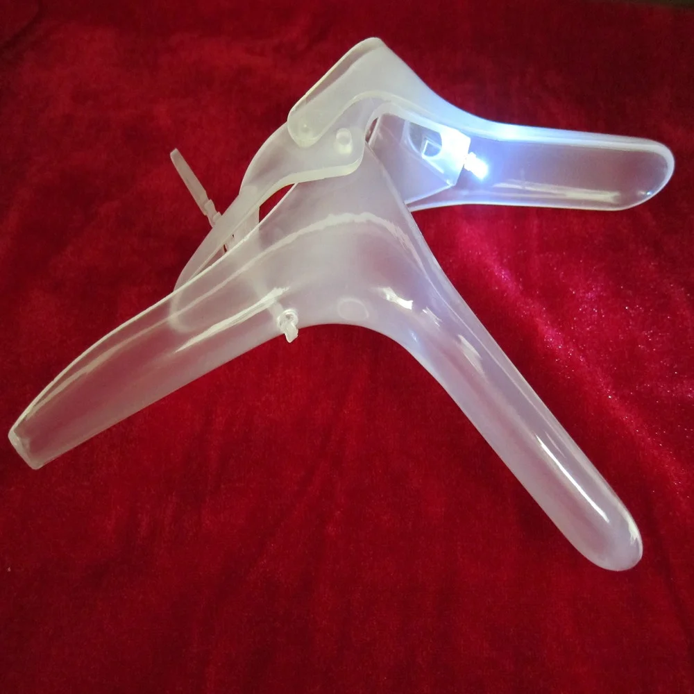 cervical vaginal spatula with light source guide