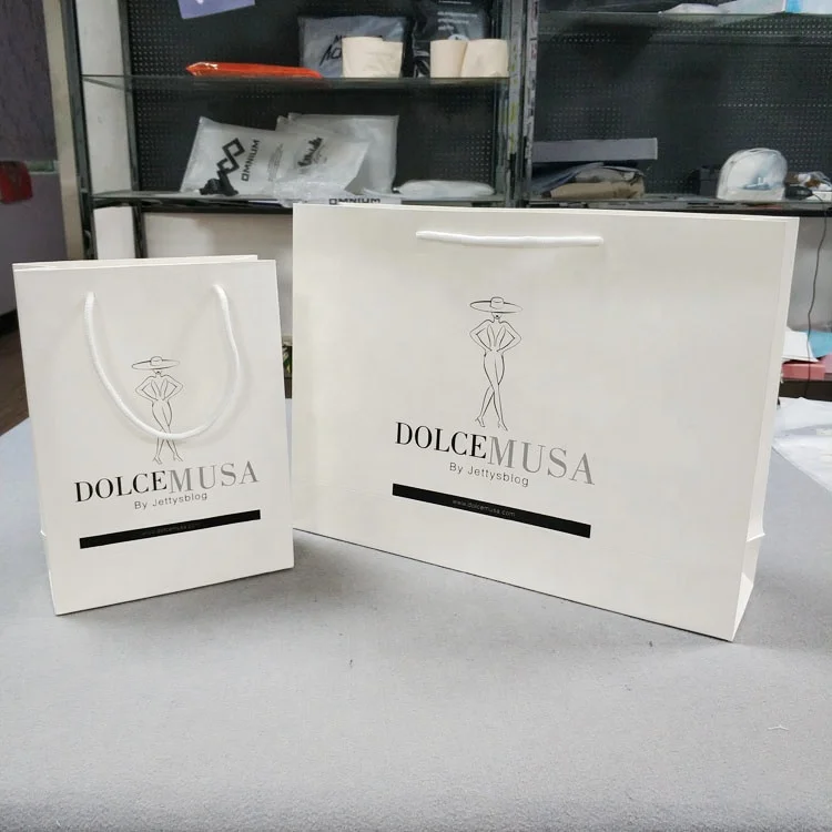 Custom White Craft Paper Bag With Logo Print Wholesale Packing Shipping Paper Bags Ribbon Handle Paper Tag For Clothes Store