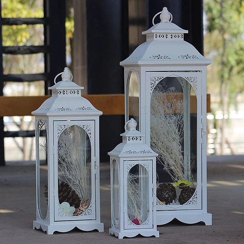European retro hollow wind lamp, handicraft decorative ornaments, wrought iron glass metal candle holder wind lamp