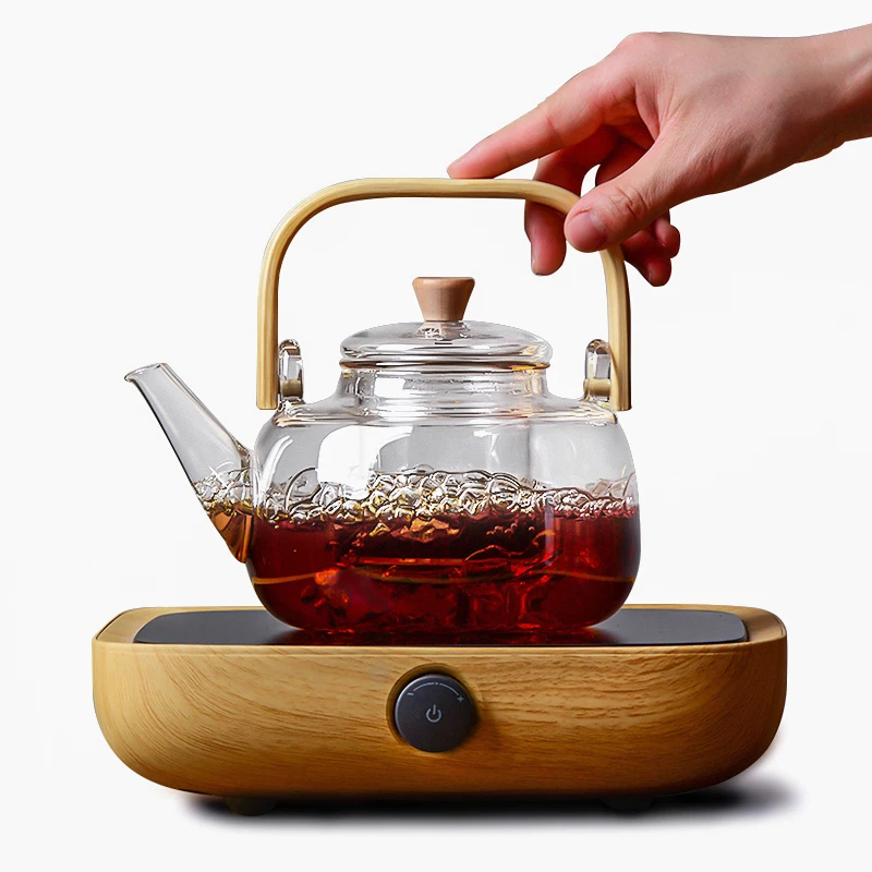 Стеклянный чайник с бамбуковой ручкой, цветущие чайники с листьями