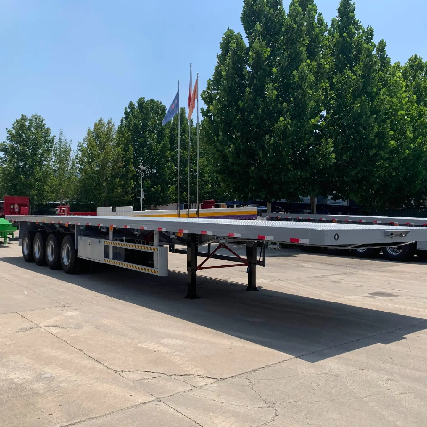 Hot Sale Best Quality  China Manufacturer Customize 3 Axle 20 Ft 40 Ft Container Transport Flatbed Semi Trailer