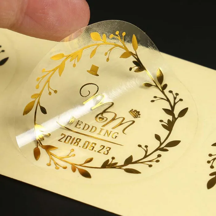 
Custom Printing Transparent Roll Logo Labels Clear Waterproof Gold Foil Vinyl Self Adhesive Labels 
