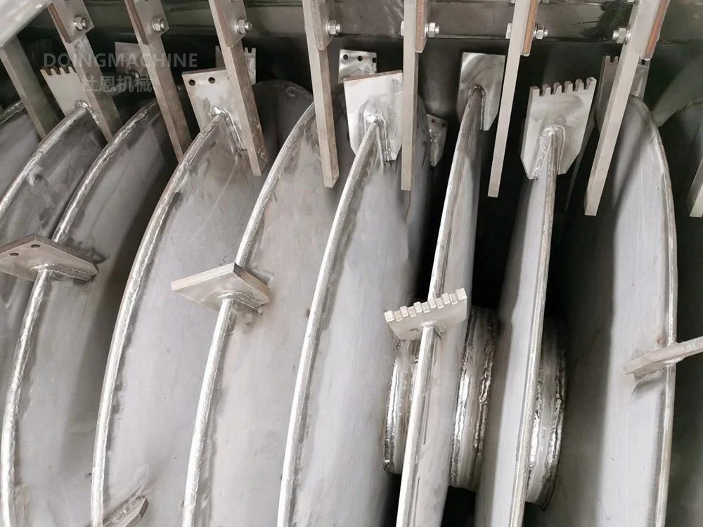 Low temperature heat pump vacuum paddle dryer for sludge