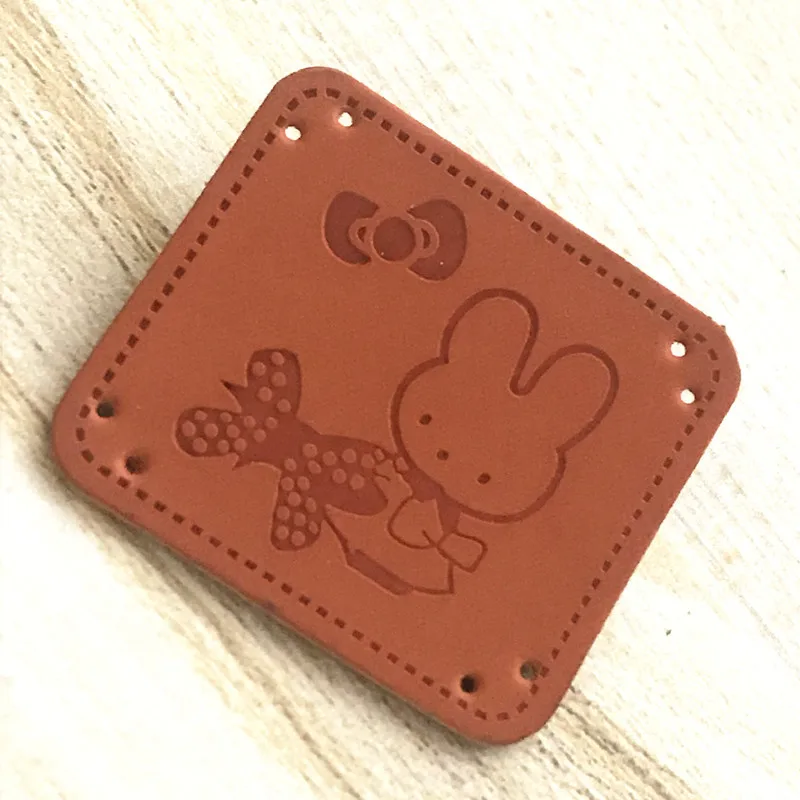 Wholesale Custom leather labels for bags Emboss Leather Labels Metal Logo Leather Patches on Gold Iron for clothes garment