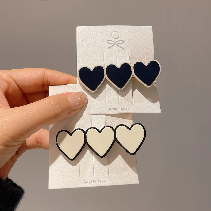 Оптовая продажа 2023 горячий дизайн ацетатные белые черные улыбающиеся сердца для девочек челки украшение утка бис зажим