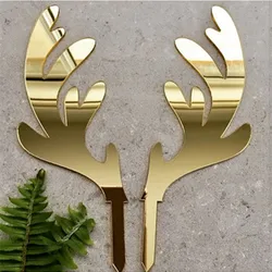 A pair of gold elk acrylic Christmas cake topper for cake decoration