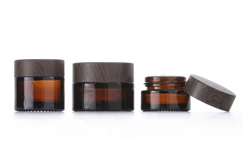 5g 10g 30g 50g 100g 4oz Custom Glass Eye Face Body Empty Cream Cosmetic Amber Jar With Black Dare Wood Lid Cheap prices