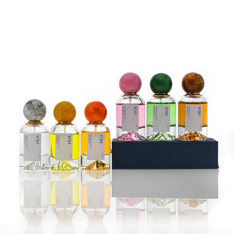 Luxury 50ml round glass perfume bottle with marble covered mountain bottom unique perfume bottle