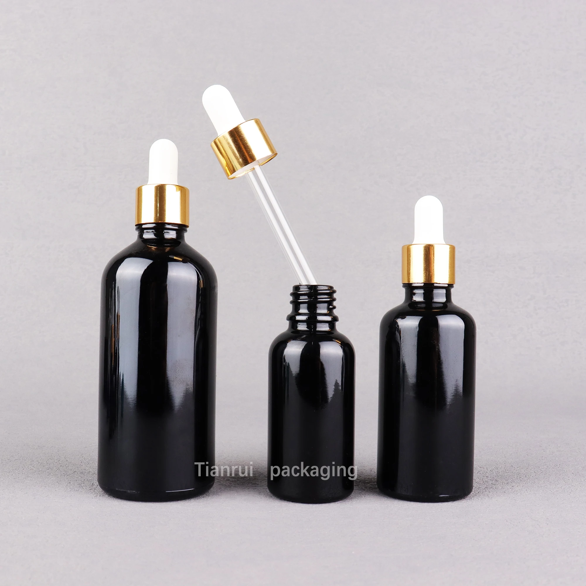 Custom 5ml 10ml 15 ml 20ml 30ml 50ml 100 ml UV Proof Black Essential Oil Glass Dropper Bottle with Sliver Lid in Bulk