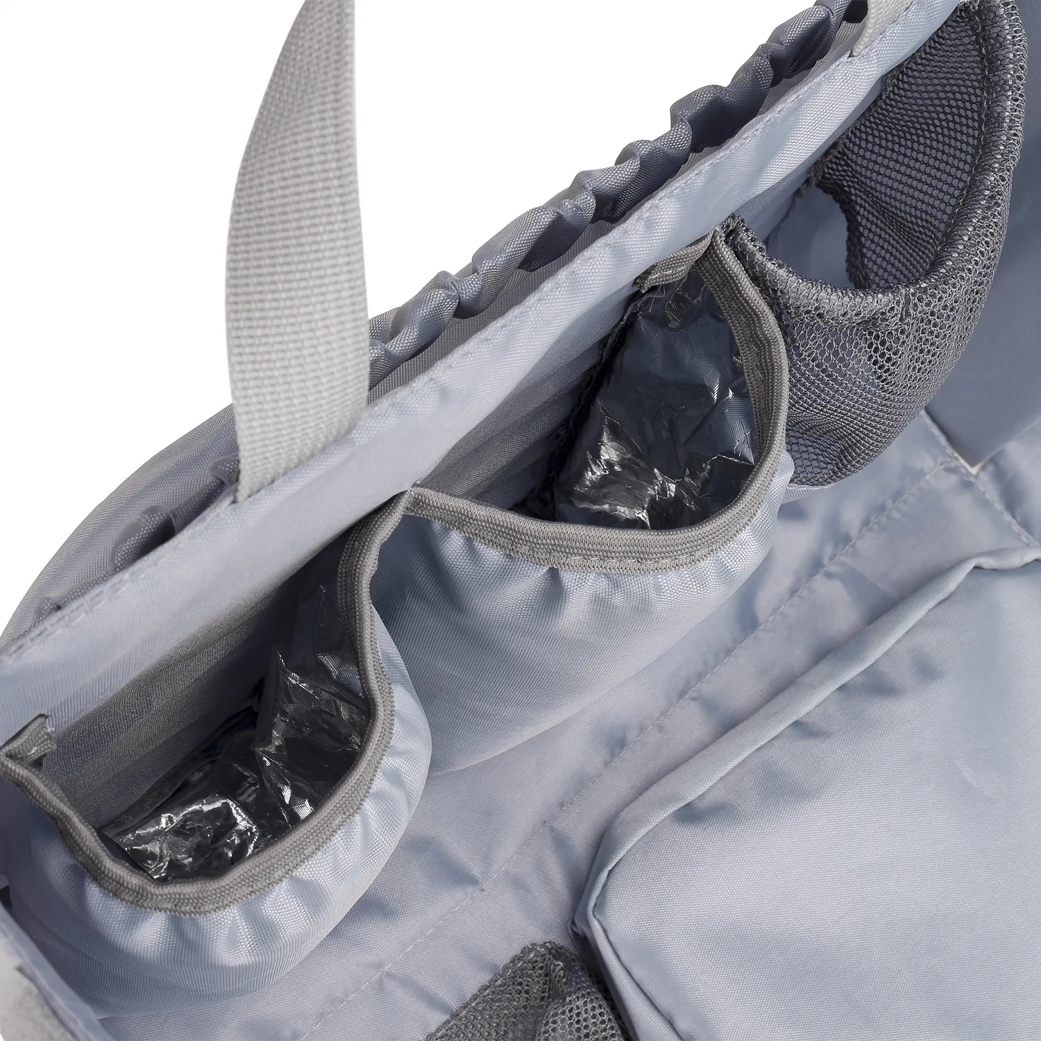 Detachable diaper bag liner with 6 total pockets, including an insulated pocket, keychain and washable changing pad.