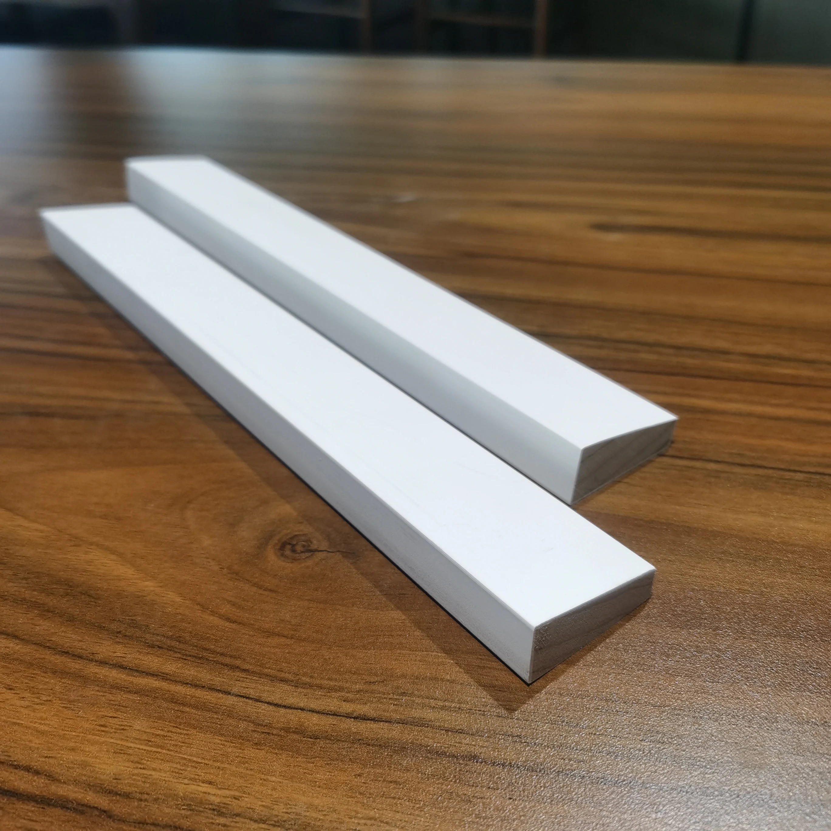 white primed wooden window sill wooden panel door skirting moulding wood frame