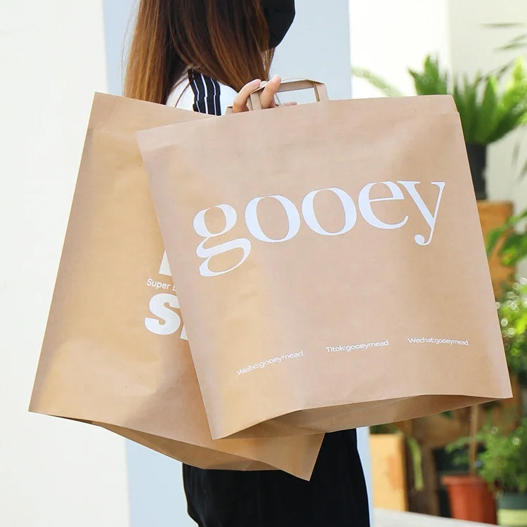 China Wholesale Custom Logo Kraft Paper Shipping Bag with Handles for Mailing Clothes Envelope