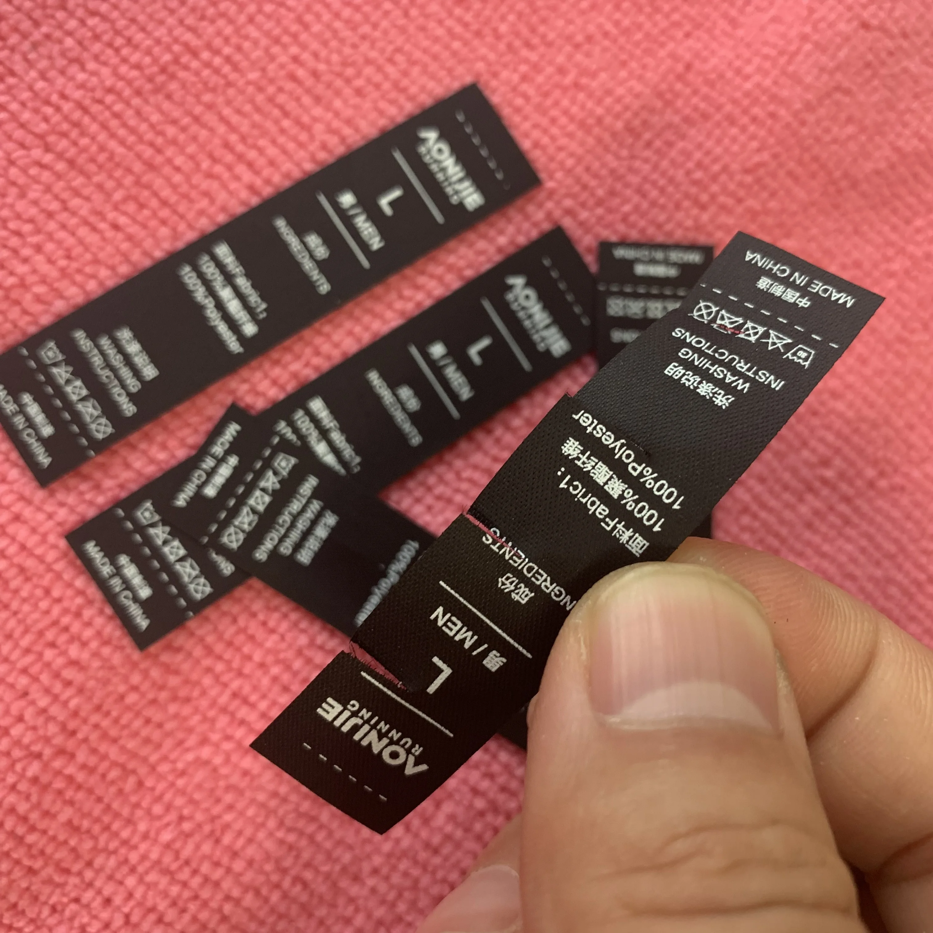 peel off washing instruction black tearaway fabric label,free sample tear away washing tags