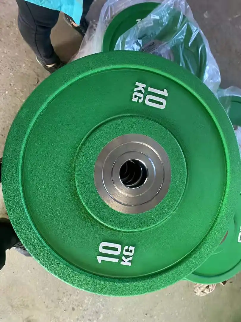 Cheapest price weight lifting barbell 25kg 50 pounds set colorful disc washer competition bumper plate