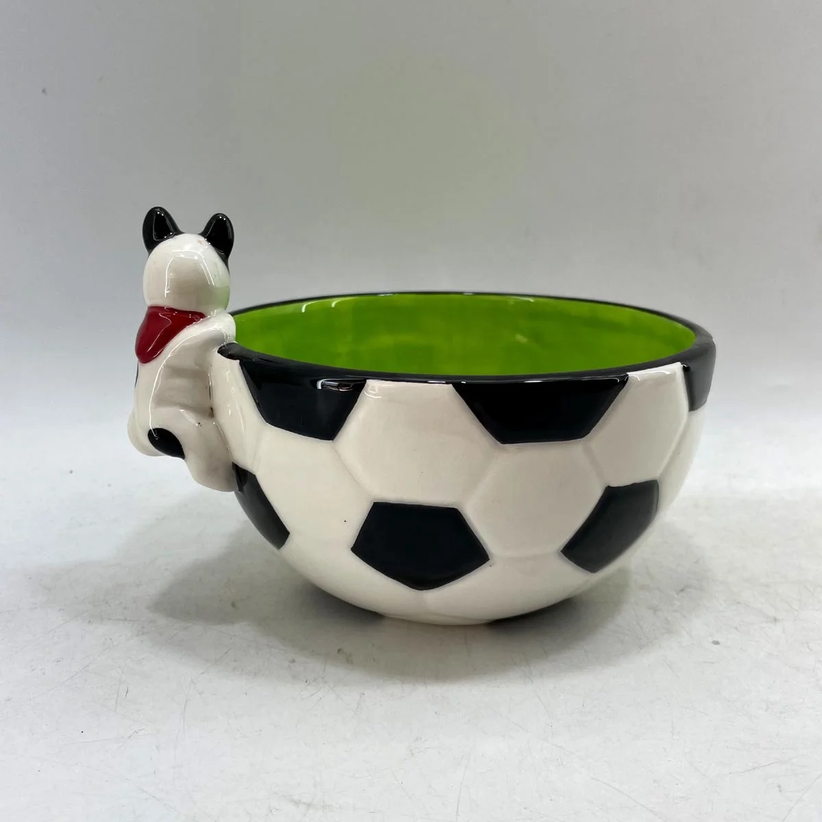 Hand painted ceramic football shaped candy bowl with dog handle