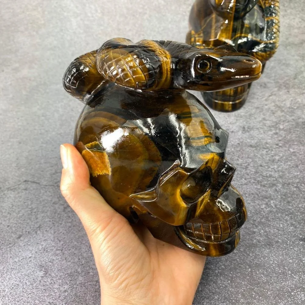 Customized product hand carved crystal skull with snake art sculpture folk crafts tiger eye skull for decoration