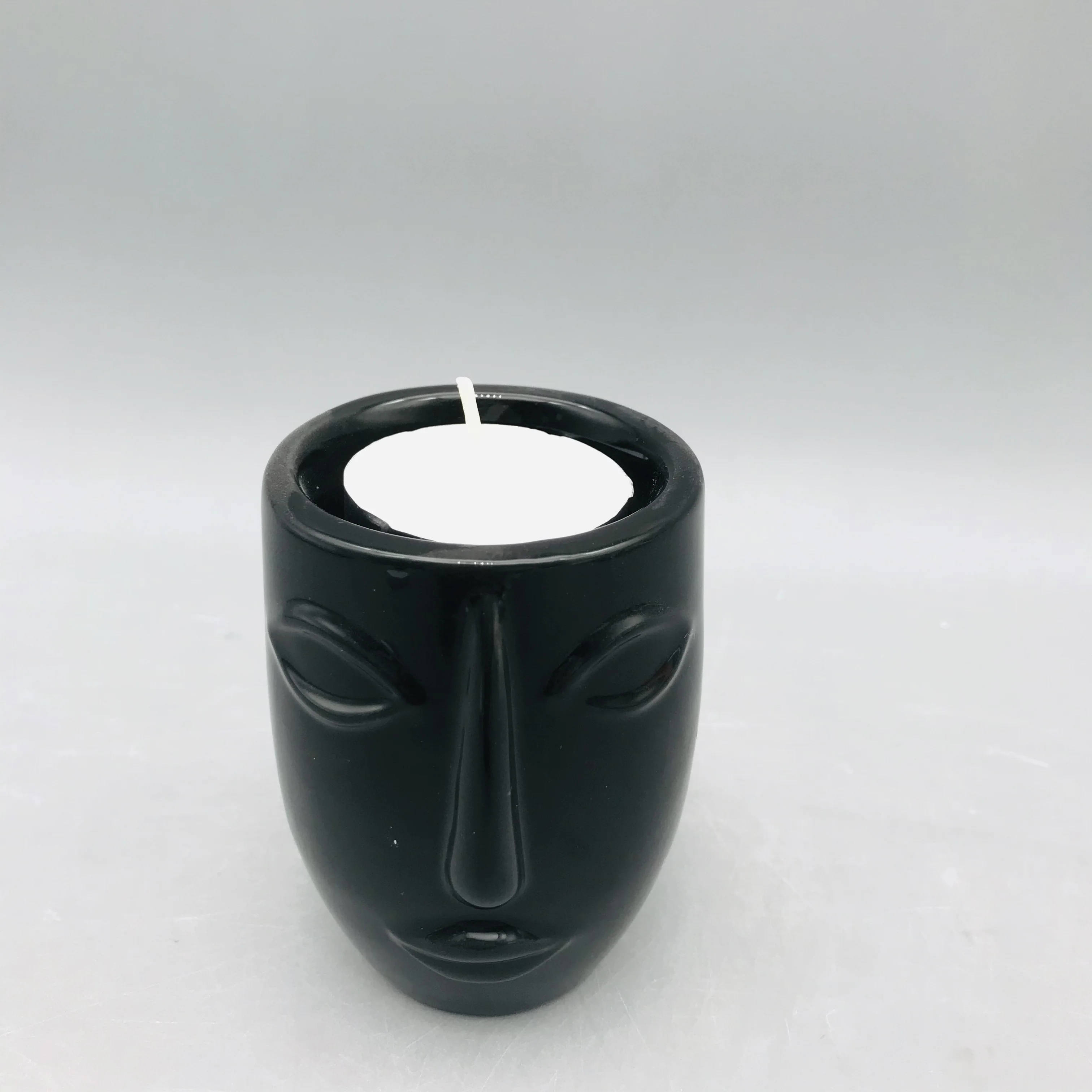 
Customized black and white ceramic human face candle holder 