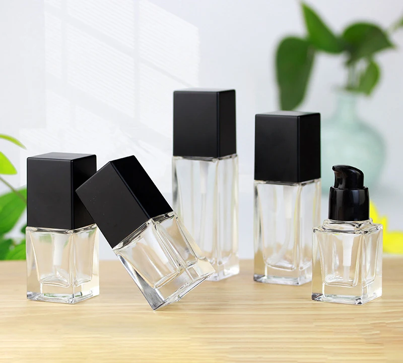 Beautiful empty 30ml cosmetic glass lotion bottles with pump dispenser