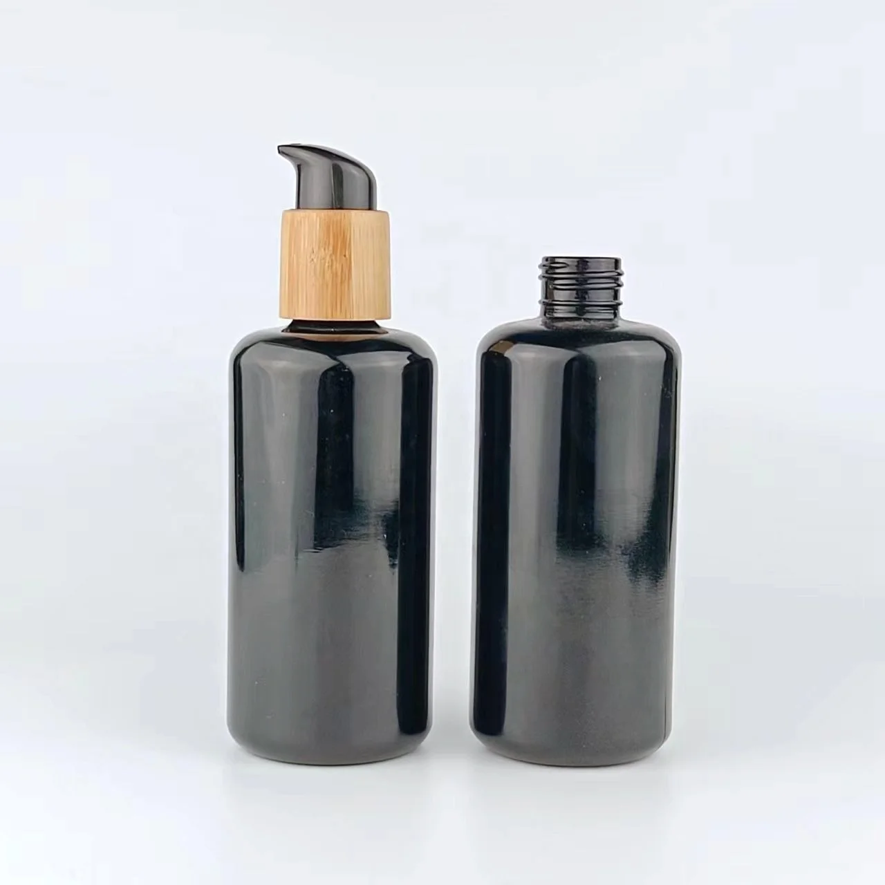 200ml glass bottles with bamboo pump empty cosmetic packaging black glass bottle body milk bottle with lotion pump