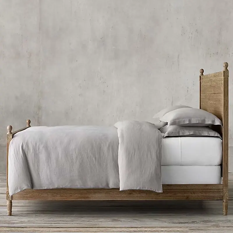 Custom furnished French style bedroom with large solid wood bed