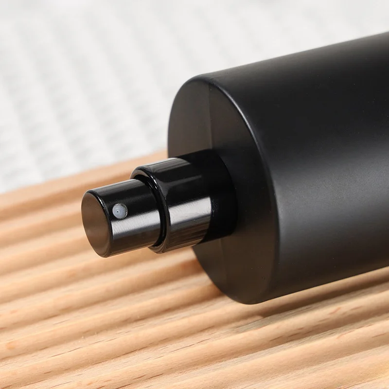Wholesale Matte Black Glass Perfume Bottle 50ml Round Perfume Glass Bottle With Black Cap