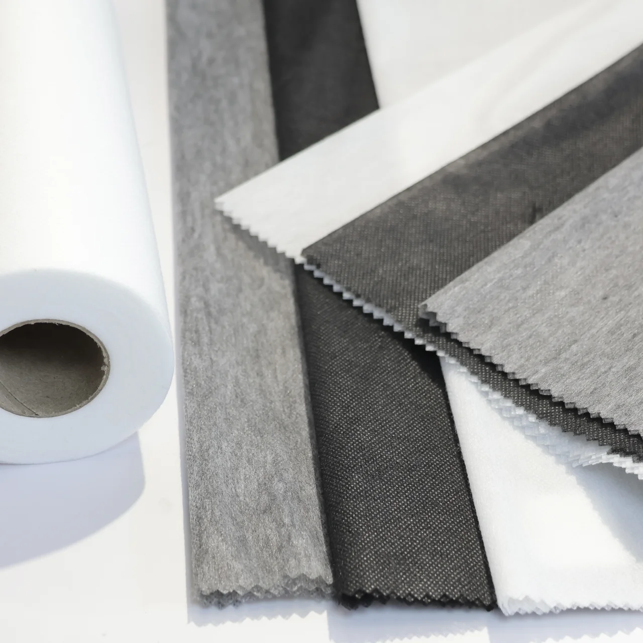 100% Polyester Nonwoven Fusible Interlining Hot Melt Adhesive Tape Interlining For garment Materials Interlining