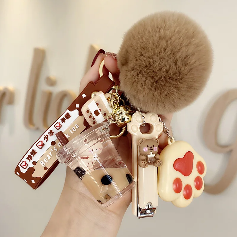 Creative Milk Bottle Crystal Milk Keychain Cute Hairy Ball Flowing Liquid Key Chain Milk Tea Bear Floating Liquid Keyring