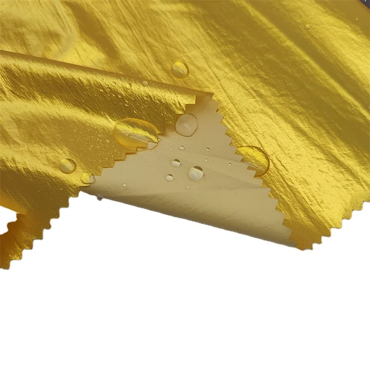Designer abrasion-resistant ripstop shiny nylon waterproof 148GSM oil cire fabric for outdoor jacket down coat