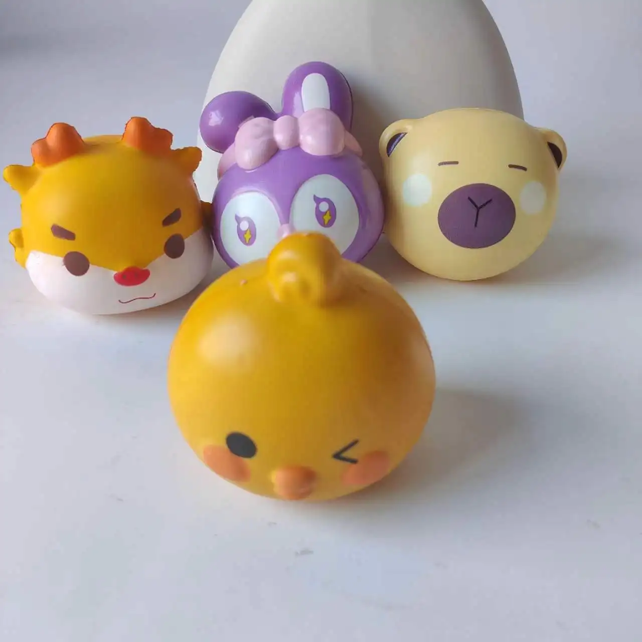 Wholesale hot selling relief popular animal head elastic rabbit chicken dragon kids squeeze PU slow rebound fidget toy