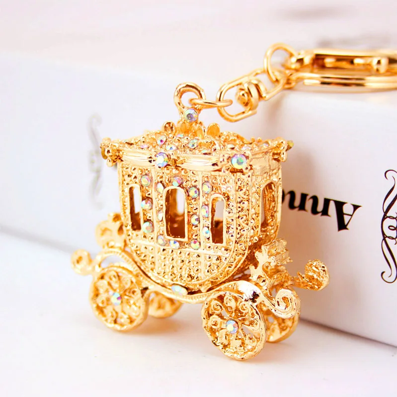 Unisex luxury rhinestones metal anime promotional accessories fine cartoon cute pumpkin wagon keychain
