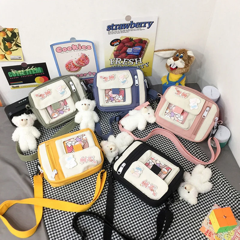 The new 2022 single shoulder slope across soft sister little girl cute nylon canvas bag bag change mobile phone lipstick female