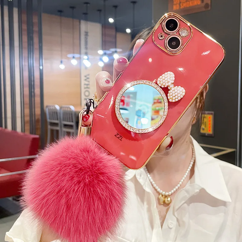 Fashion Luxury Bow Rhinestones Mirror Back Cover Plating TPU Fur Ball hand strap Girls Phone Case for iPhone 13 12 Pro Max