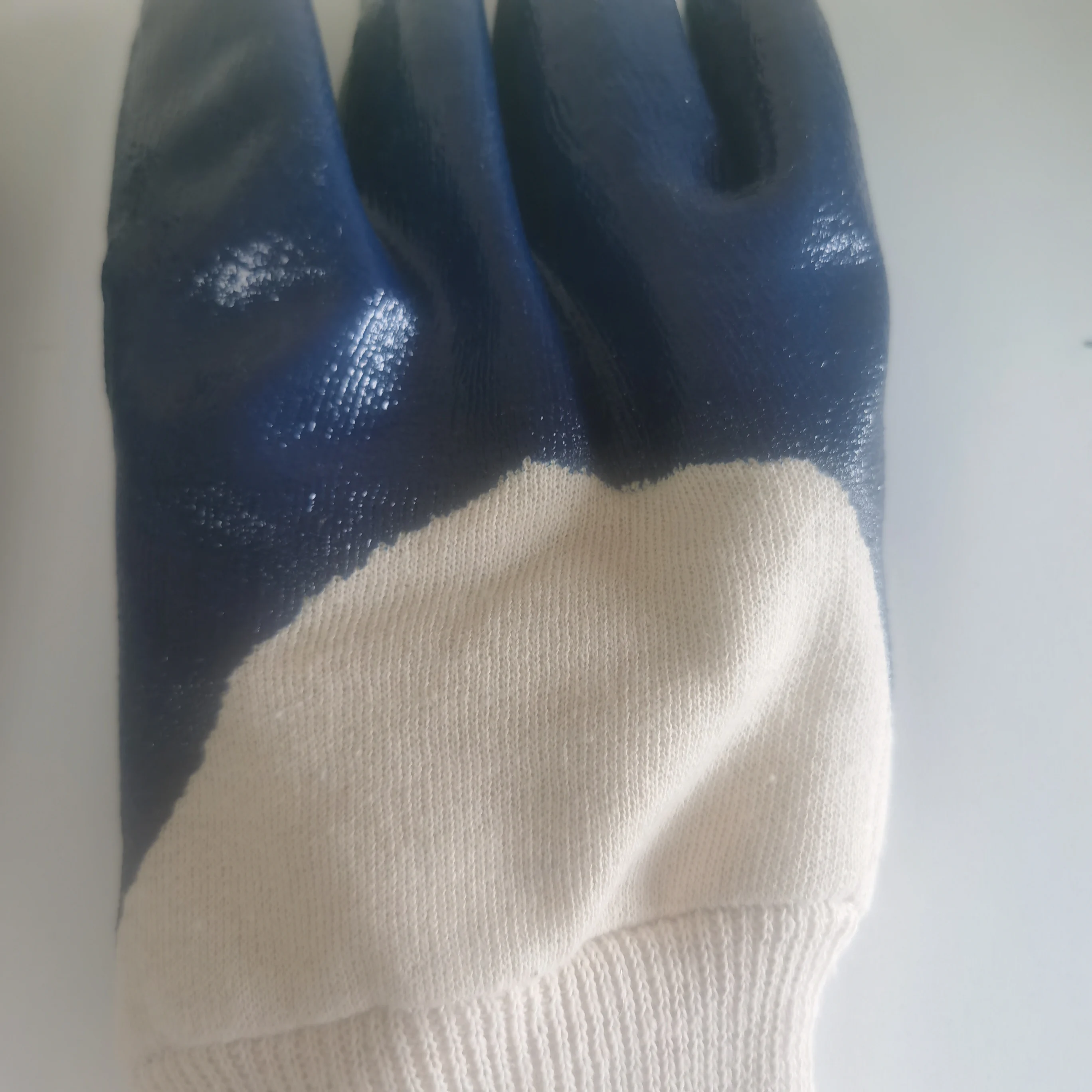 
bule nitrile coated with jersey liner smooth finish with knit wrist gloves 
