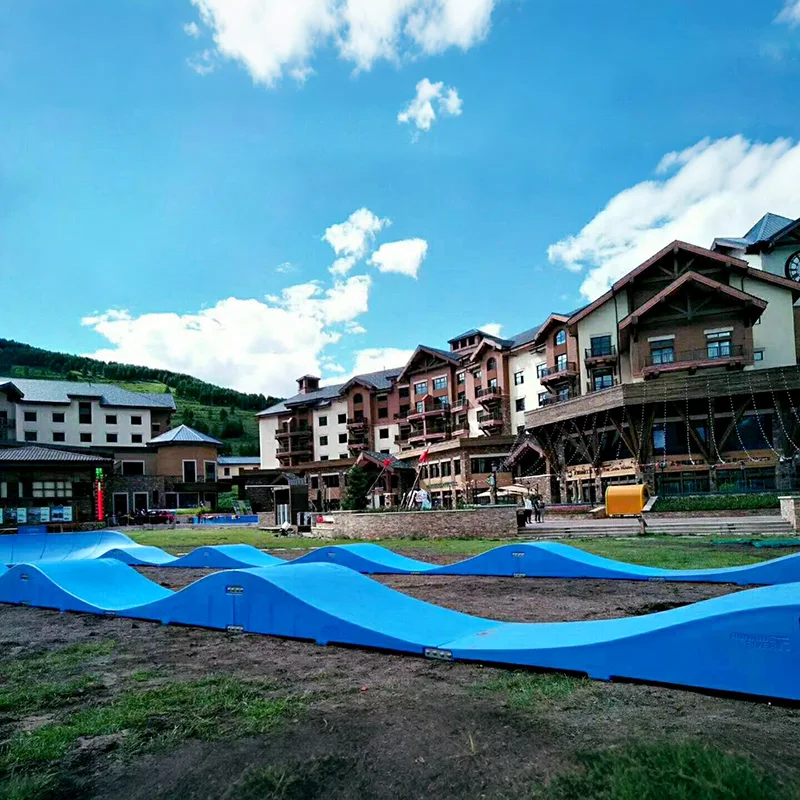 Plastic modular pump track velocity loop 2 is a sequence of roll overs  and berms  for bikes, BMX scooters and skateboards