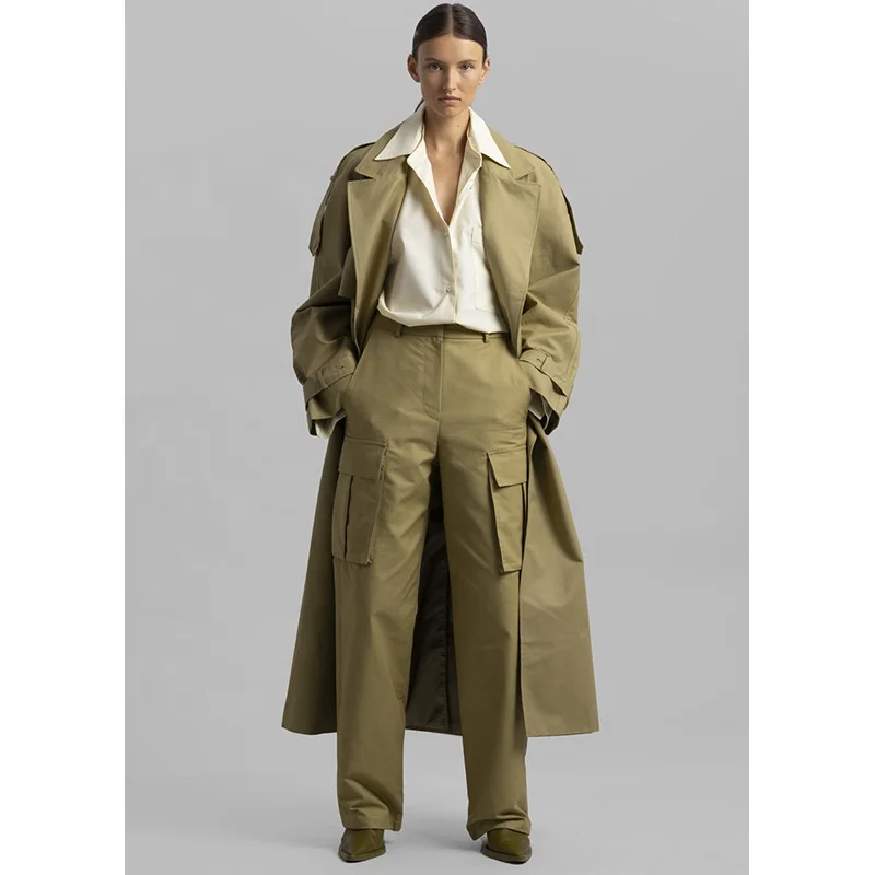 Khaki cotton trench Oversized silhouette Storm flaps Adjustable belted cuffs High vented back Front pockets trench coats women
