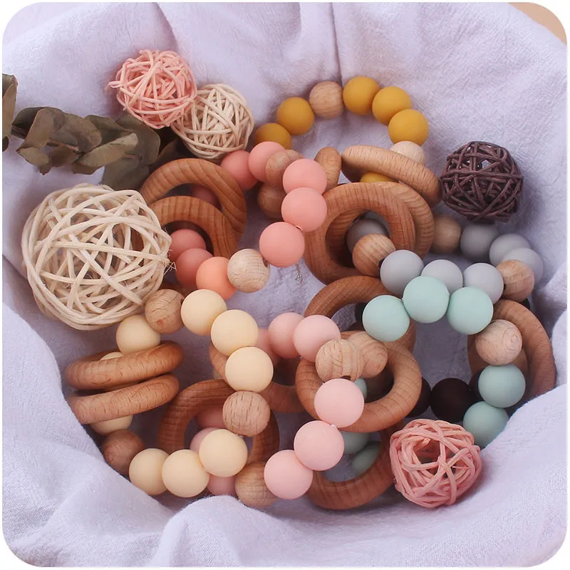 Hot Sell Newborn Silicone Beads Diy Baby Silicone Rattle Wrist Ball Teether Ring Beech Wooden Teething Ring Toys Bebe Gift