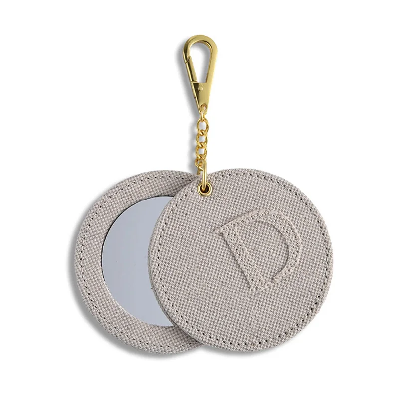 PU leather fabric wrapped circular rotating mirror chain keychain hanging bag mirror portable small gift mirror