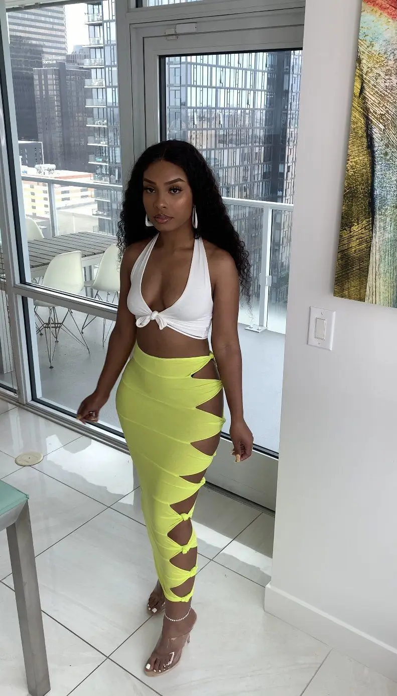 Street sexy solid color knotted and ripped stitching female long skirt