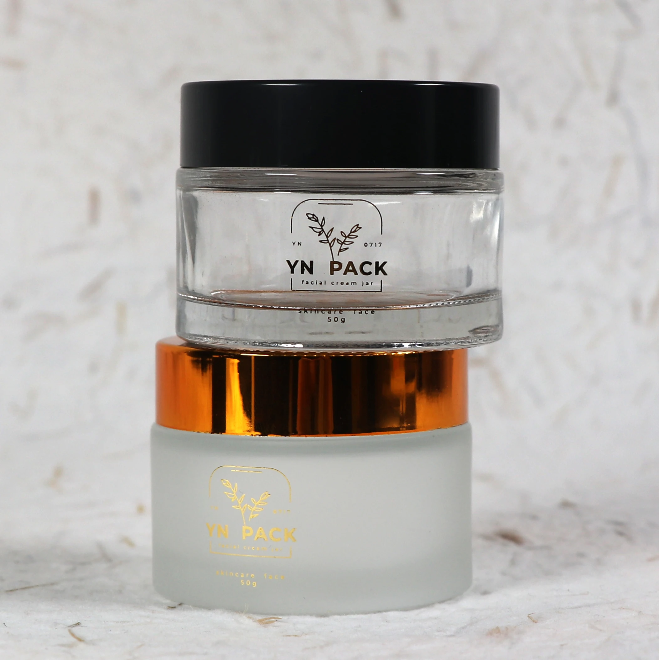 Wholesale Custom glass jars gold lids cosmetics skincare glass jar 2oz with lid