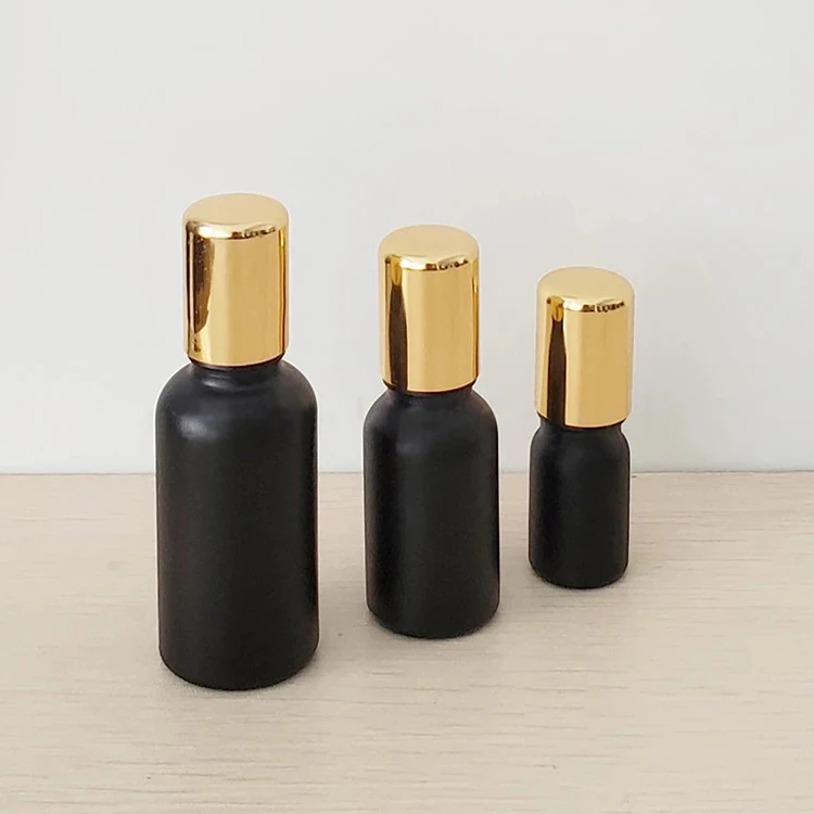 Customized wholesale 30ml 50ml matte black frosted Glass Roll on Bottle with Metal Stainless Roller Ball for essential oil