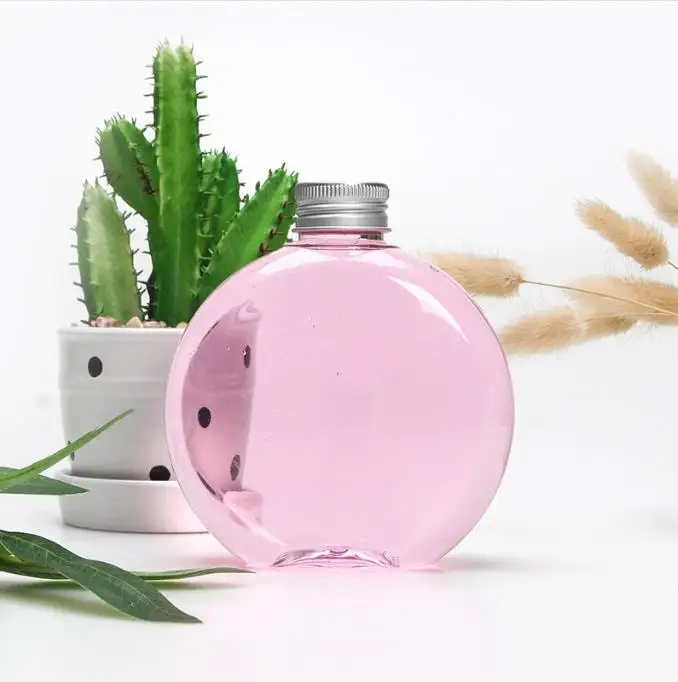 Customized High-quality 500ml 16 oz Flat Round Empty Oval PET plastic Beverage Juice Bottle for juice packing with Aluminum lid