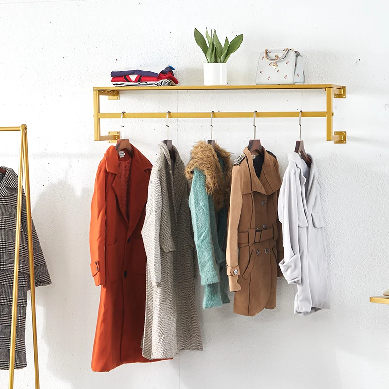 clothes shop display rack wall-mounted clothing rack decorative metal garment rack with storage shelf
