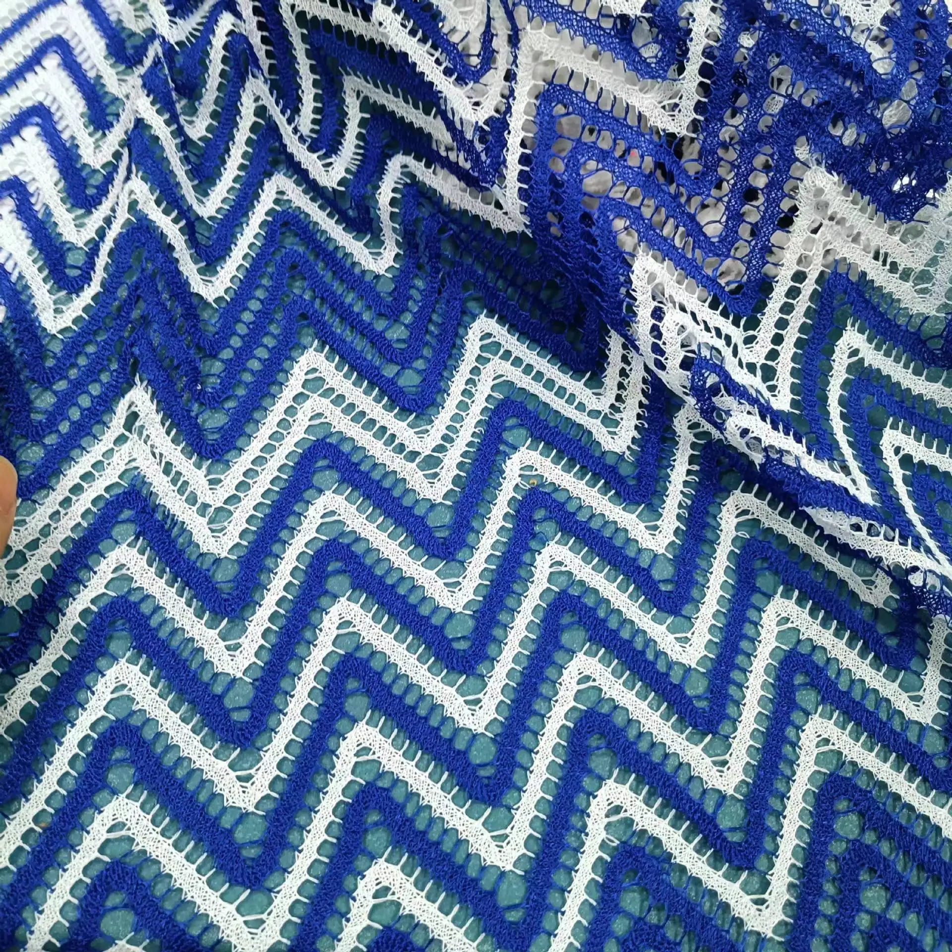 wave pattern crochet knitted fabric 3D jacquard swimwear fabric hollow breathable polyester fabrics for clothing women