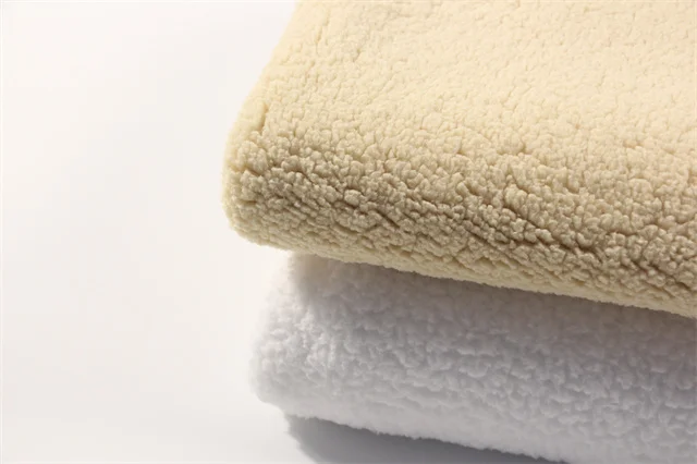 Hot sale solid color lamb wool fabric high quality polyester coral velvet fabric for clothing