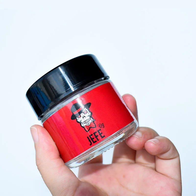 
Custom Design Food Clear Round Glass Jar For Weeds Herbs Skin Cream Bottle With Black Lid 2 Oz 