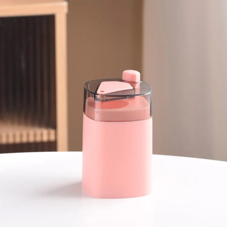Creative automatic pop-up toothpick holder with press button suitable for restaurant and home use featuring a unique design
